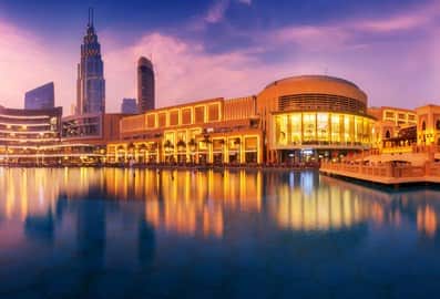 Panoramic view of the Dubai Mall at sunset.