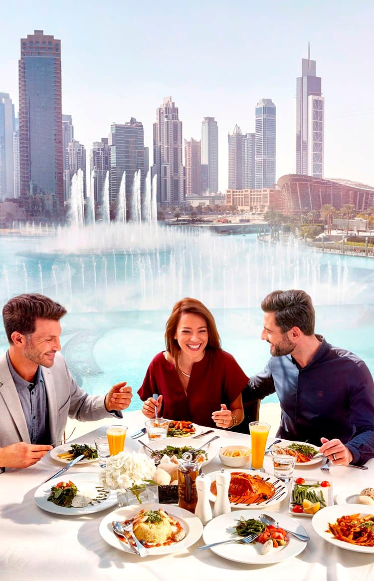 Group dining at a restaurant in downtown Dubai near the Dubai Fountain.