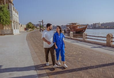 couple walking dubai old town