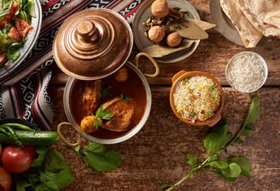Traditional Emirati fish dish placed on a beautifully set table.