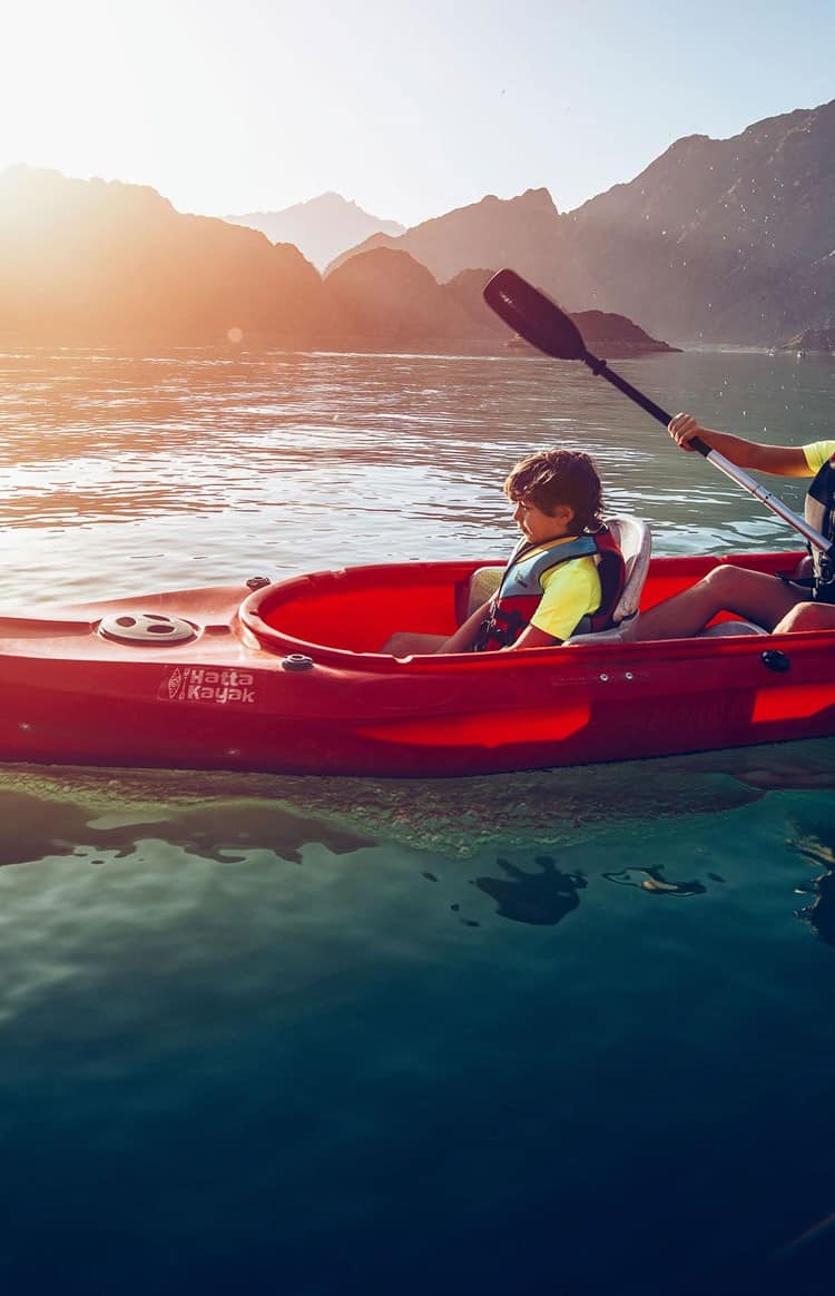 Woman and child kayaking in Hatta Dubai