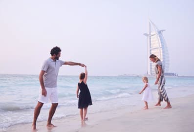Family at Sunset Beach in Dubai with Burj Al Arab in the background